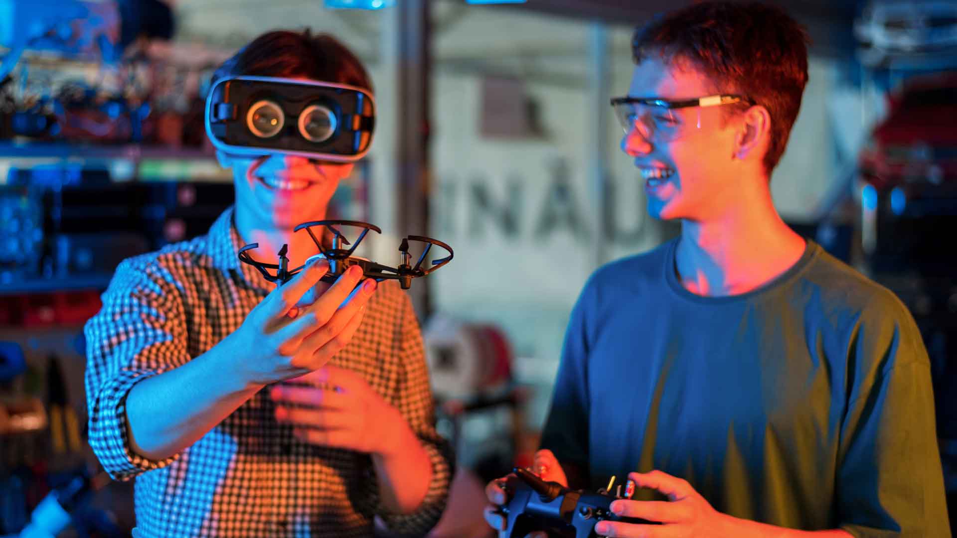 smiling-teens-doing-experiments-robotics-laboratory-boy-vr-headset-holding-small-drone